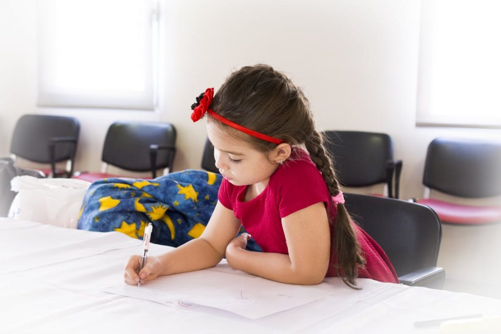 Young girl writing