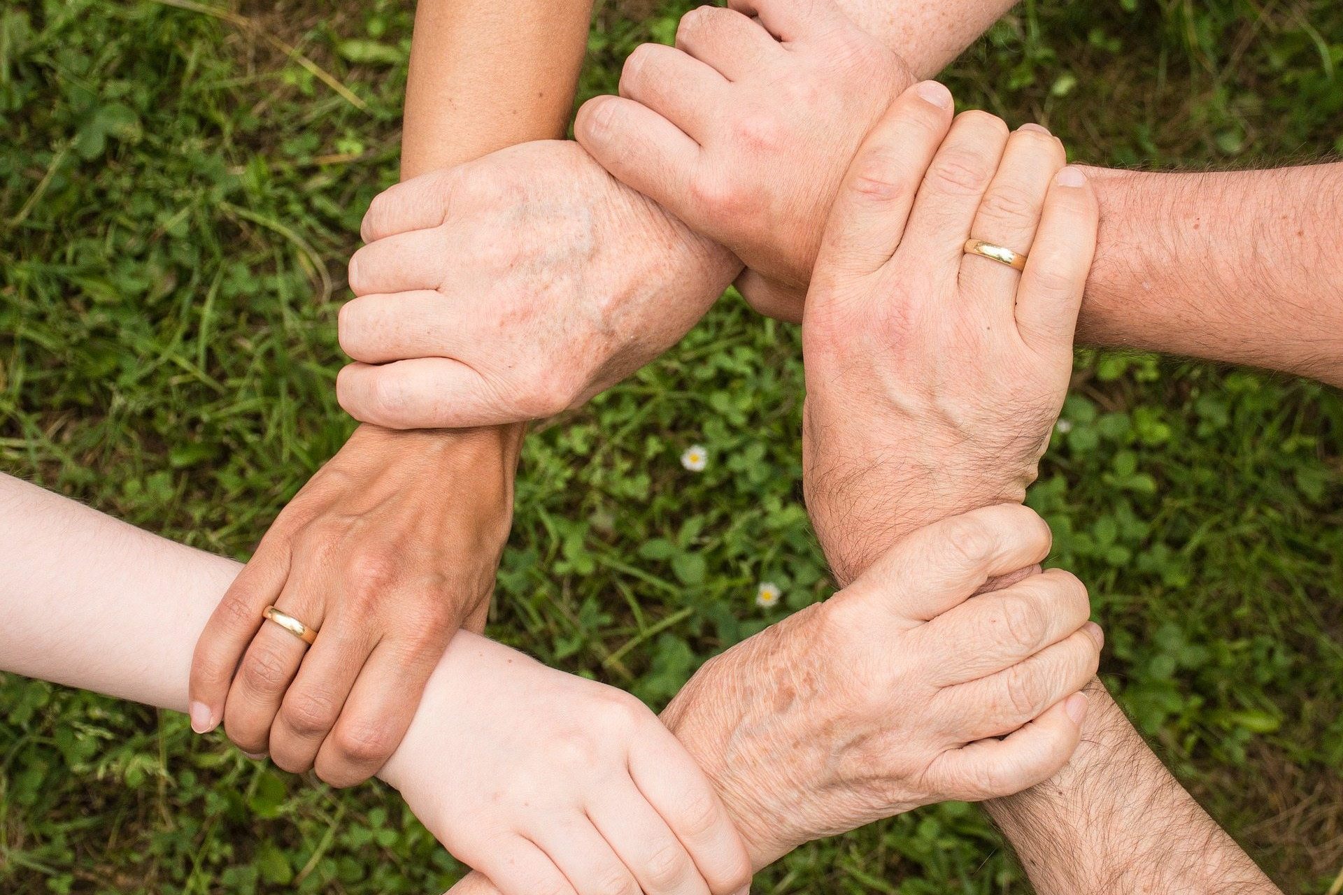 Interlocking hands representing team spirit